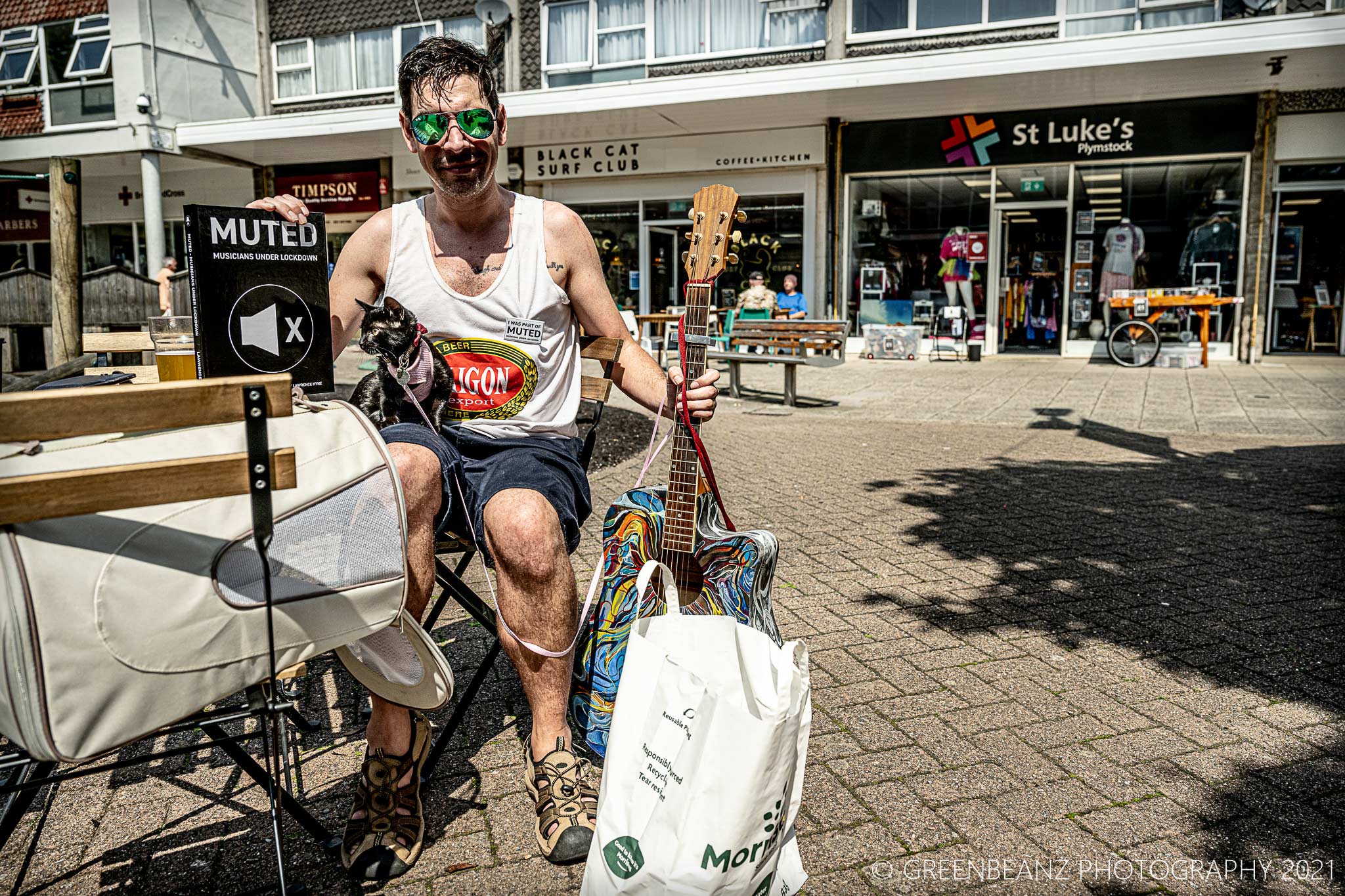 Musician Tom and his Cat recieve their copy of MUTED in 2021 on Plymstock Broadway