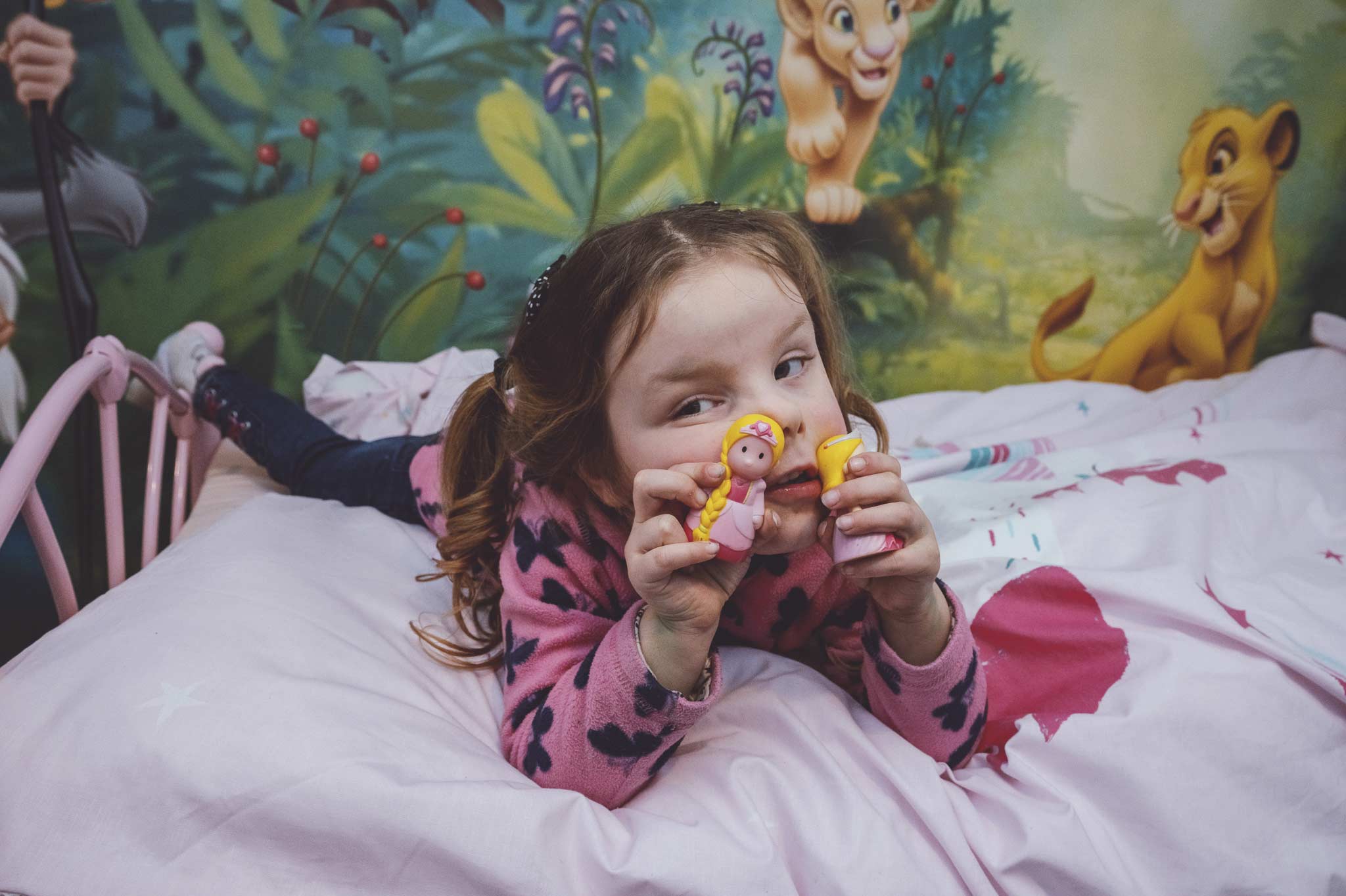 Grandaughter poses for Plymouth Photographer wiht toy up nose