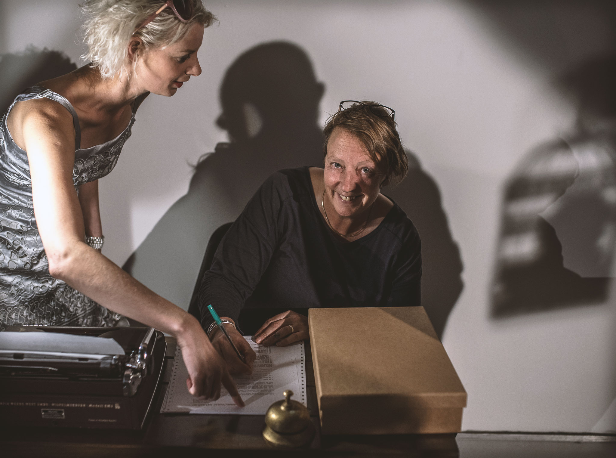 Councillor Philippa Davey completeing an application at the bureau for fostering fluff at Effervescent's 'I am not a Robot' show 