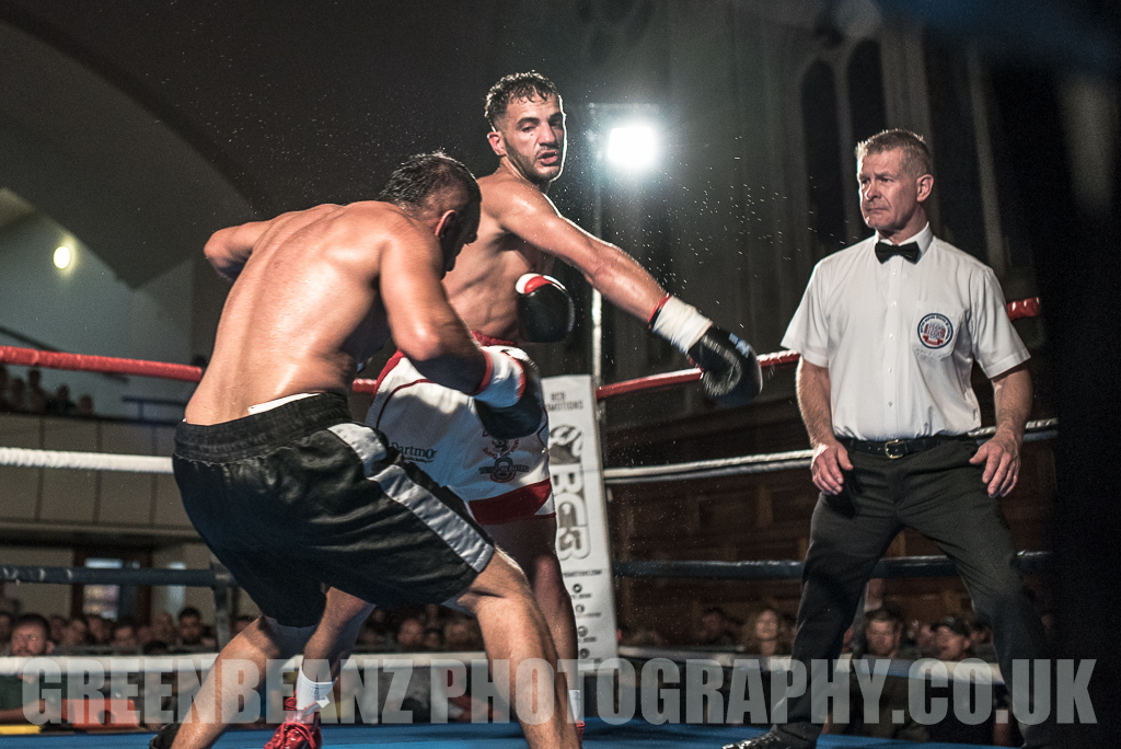 Referee Lee Cook watches Darren Townley hit Ibrar Riyaz