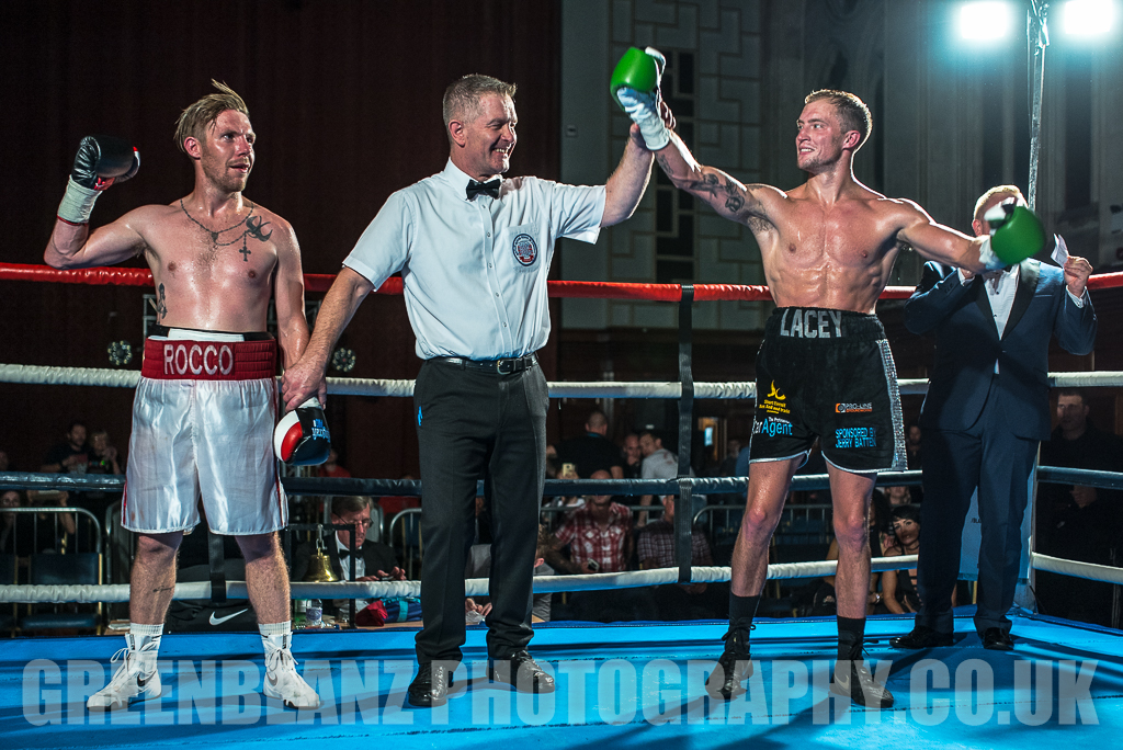 Plymouth Boxing photograph of victorious Des Newton hands aloft