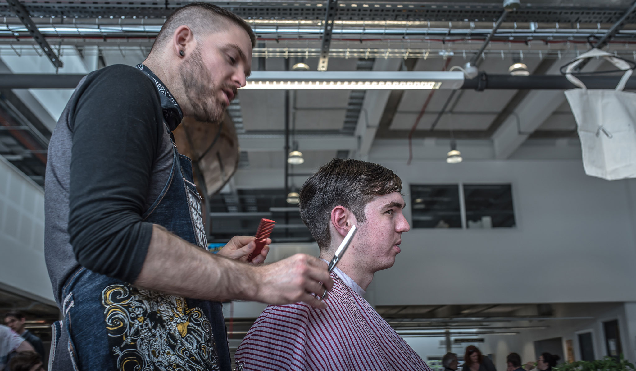 Exeter -Barber-Popup-Plymouth-Cutthepunx Pop up Barber Cut the Punx with scissorsr and customer