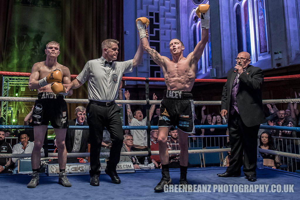 Plymouth Boxing photograph of victorious Des Newton hands aloft