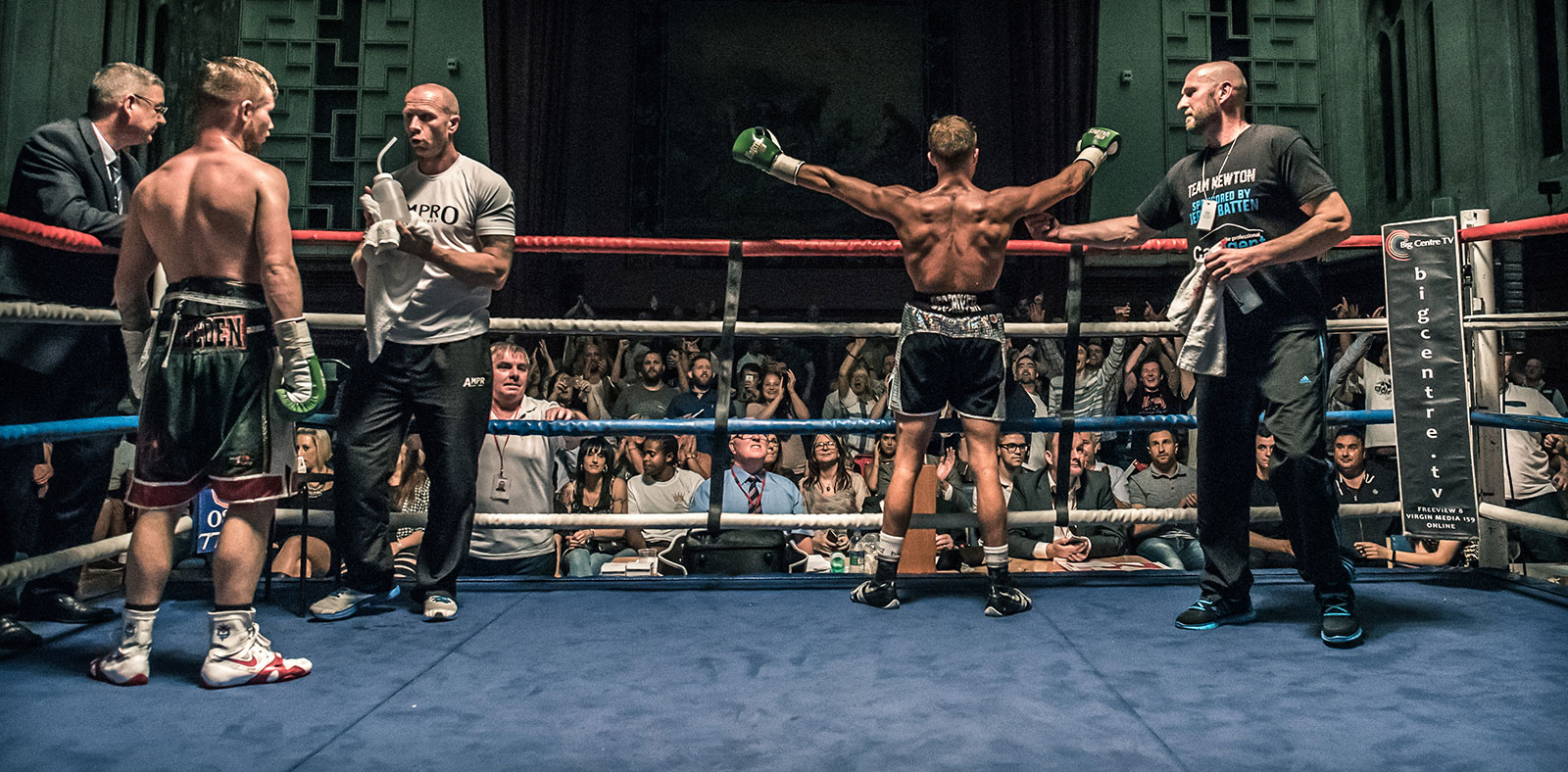 Boxer arms out wide at end of bout