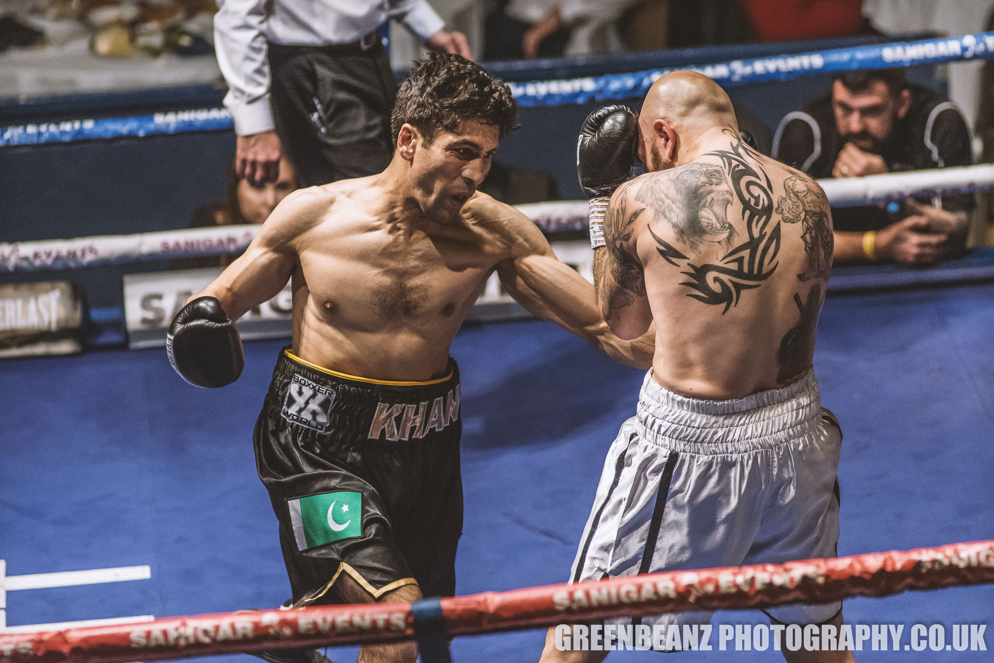Faheem Khan works the body of Danny Little in an action packed fight in Torquay 