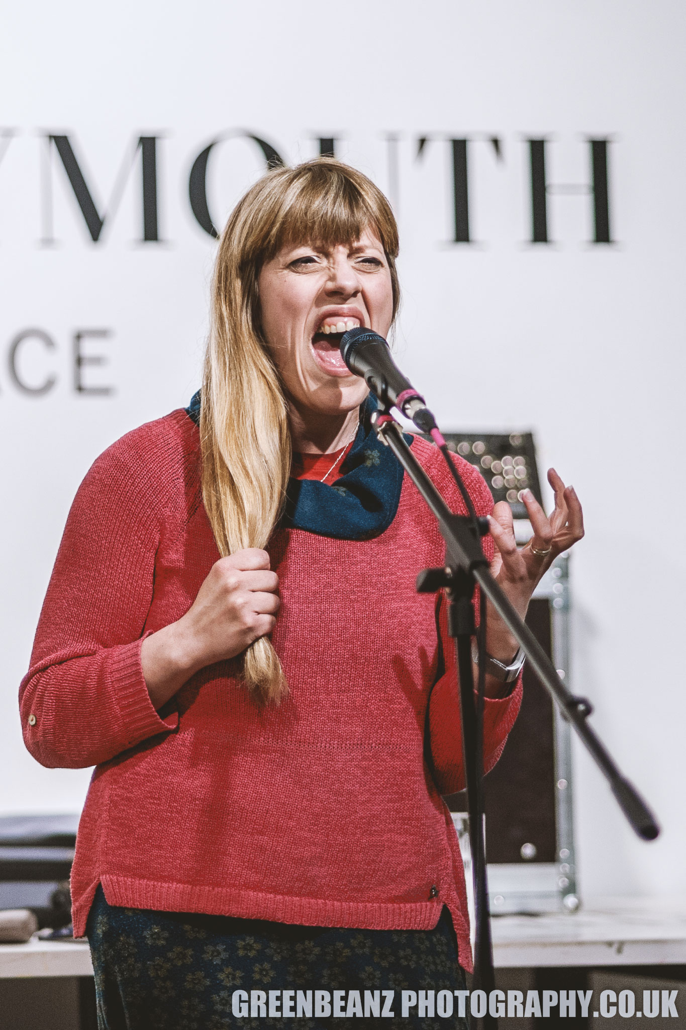 Liv Torc with her poem 'Hairloom' in Plymouth