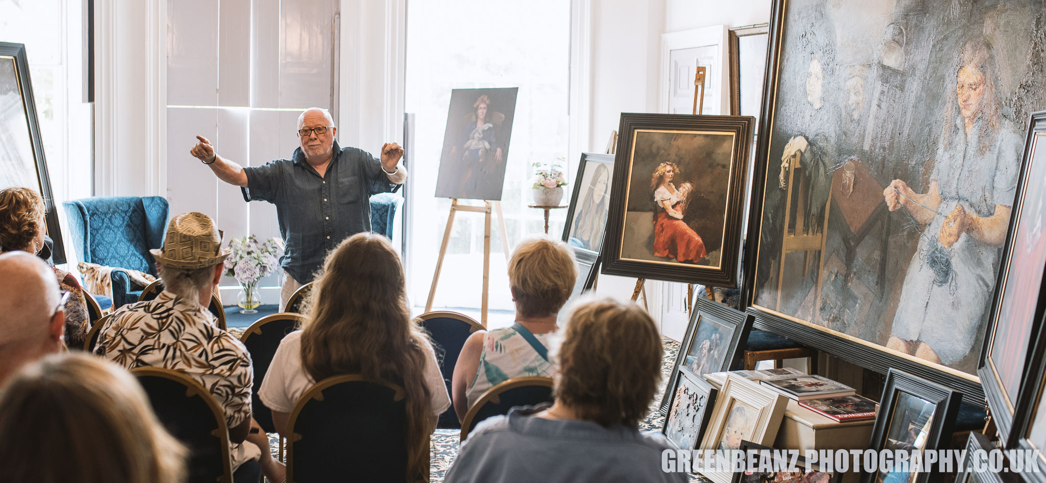 Stephen Barrett regales the audience with tales of Robert at Stephen's restaurant