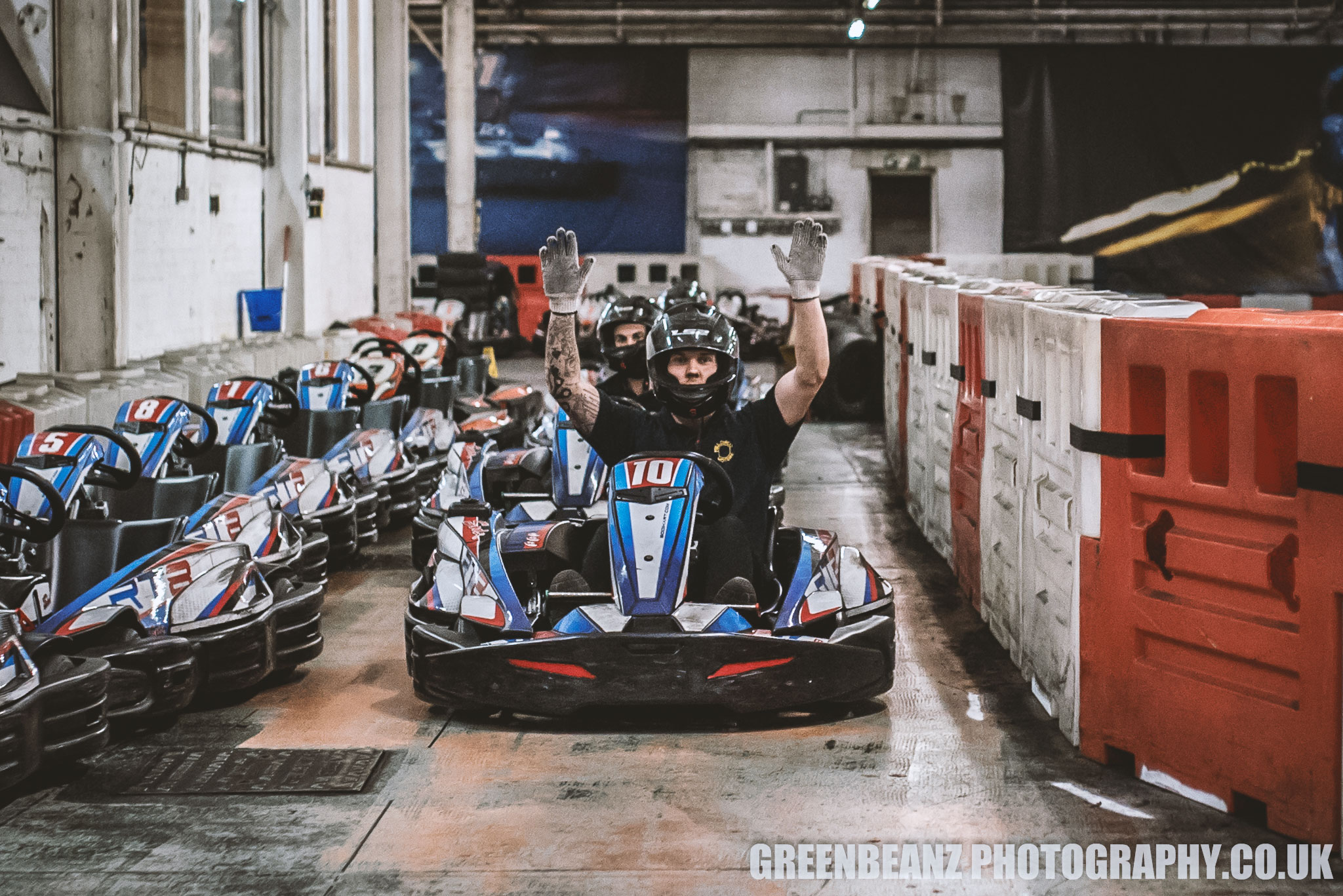 Winning Driver raises his hands in celebration at  Plymouth Karting