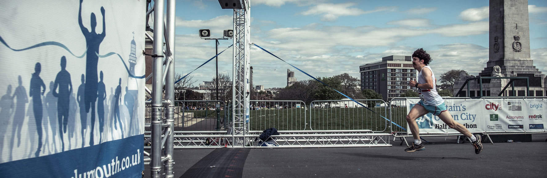 Marathon runner approaches the finish in Plymouth