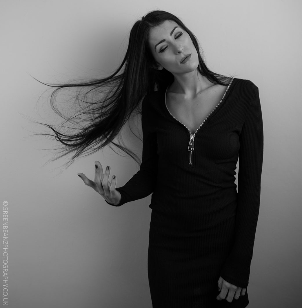 Enya models flowing hair in monochrome