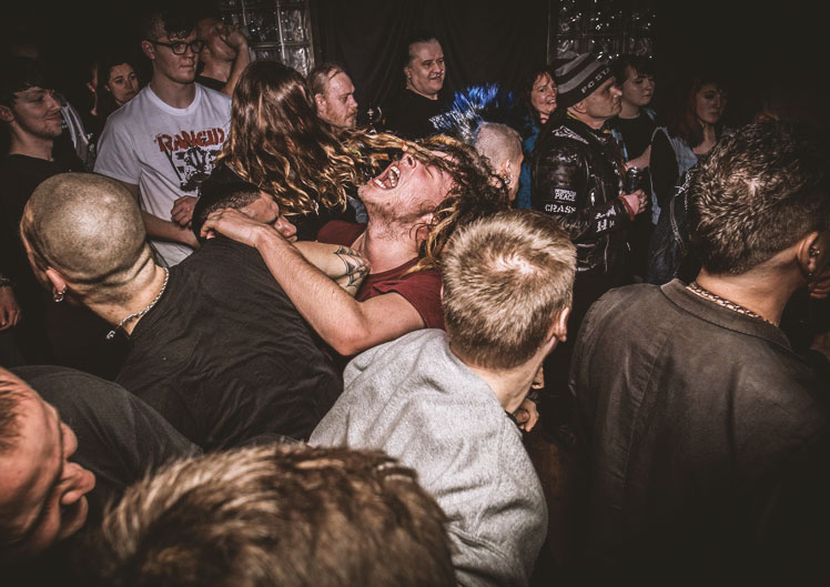Plymouth Music Photograph of dreadlocked fan in the middle of a mosh pit at a live gig The undergorund Plymouth