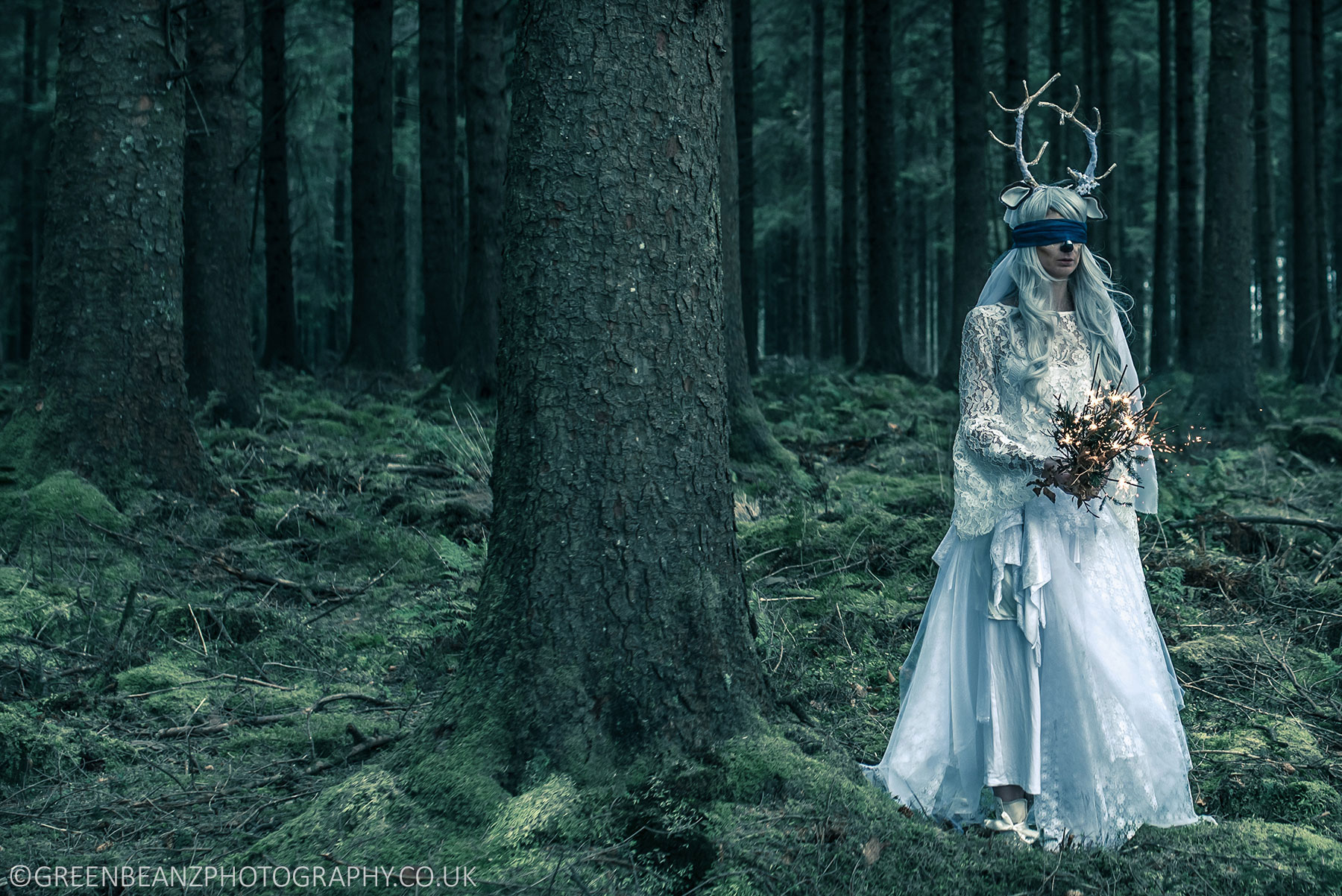 Plymouth Commercial photograph of Woman in white wedding dress in forest
