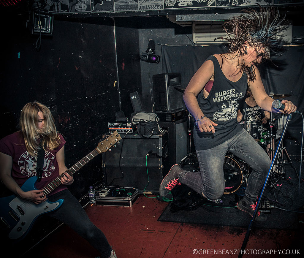  UK Punk Rock Photography of Ramonas Singer jumping on stage at Underground Plymouth Music Venue
