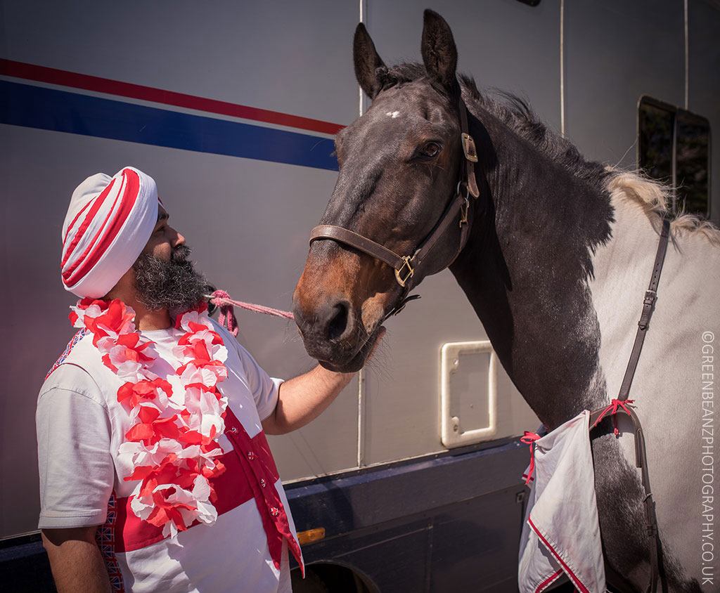 Plymouth councillor Chaz Singh dressed as St George with a horse