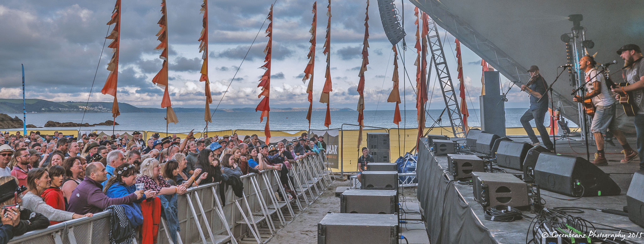 WIde shot of Ferocious Dog playing on the beach at Looe Festival